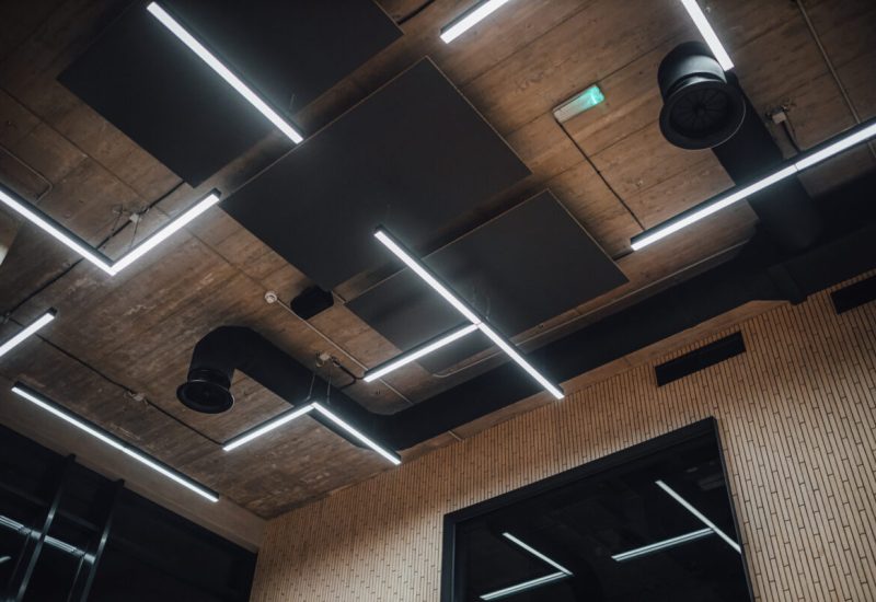 View on modern led lightning hanging from ceilings, industrial building concrete texture